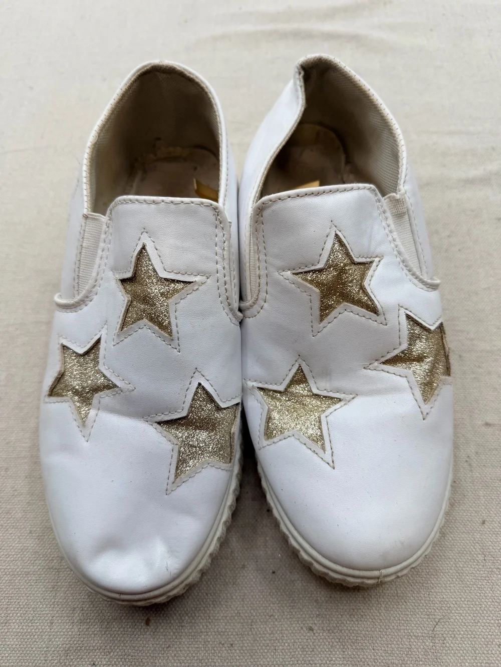 ' White Slip-On Sneakers with Gold Star Accents